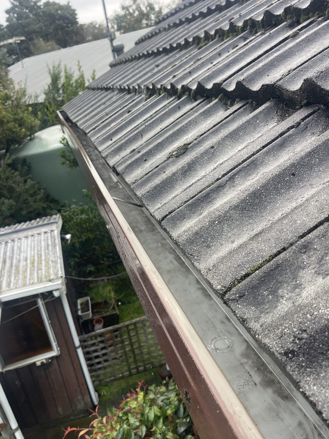 Clean gutter line on a tiled roof after gutter cleaning, Hobart