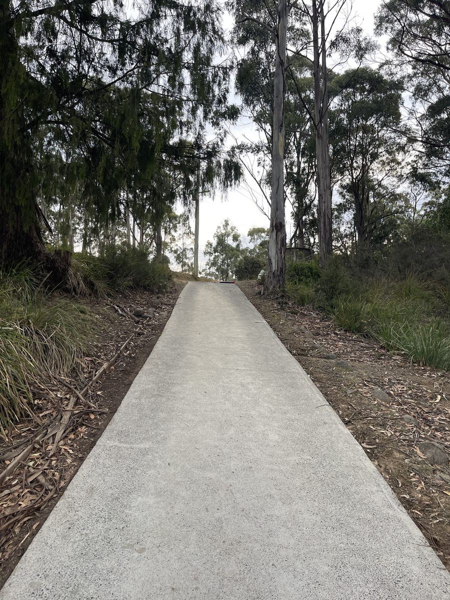 Freshly pressure washed concrete driveway on a bush block in Southern Tasmania