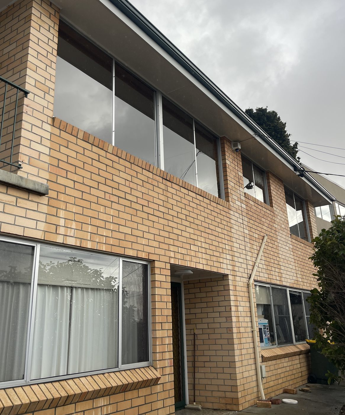 Two storey windows cleaned on a brick unit block in Hobart