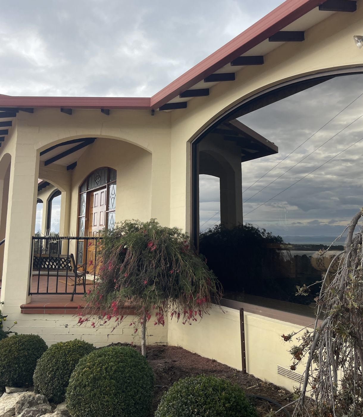 Spotless arched picture window on a character home, Southern Tasmania