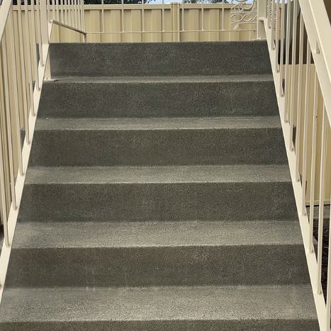 The same concrete stairs clean and even after pressure washing