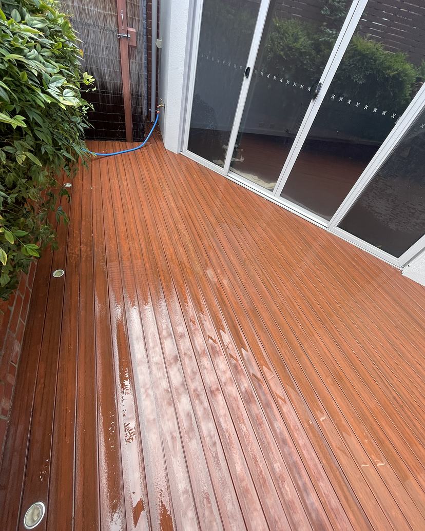 The same timber deck after cleaning, rich red timber colour