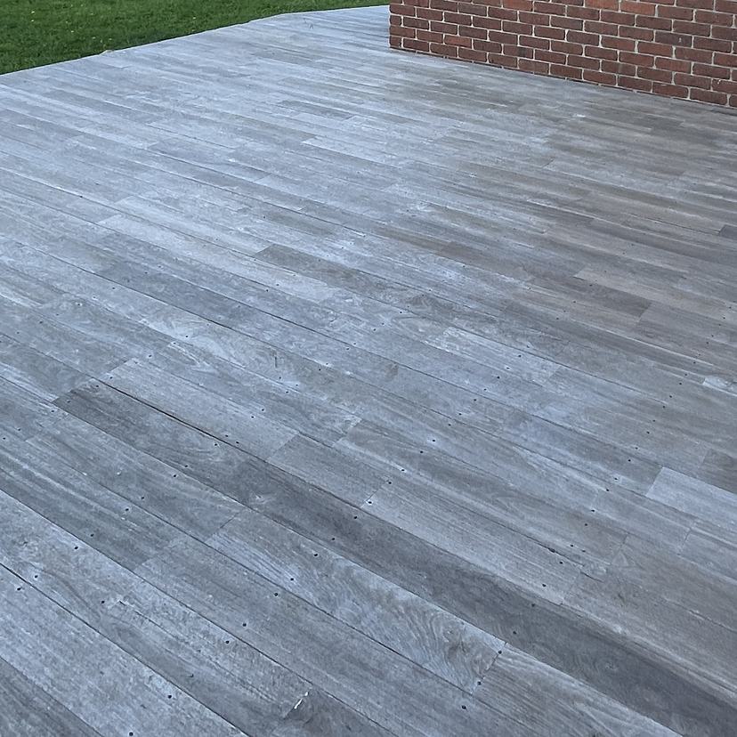 Weathered grey hardwood deck in Snug before cleaning