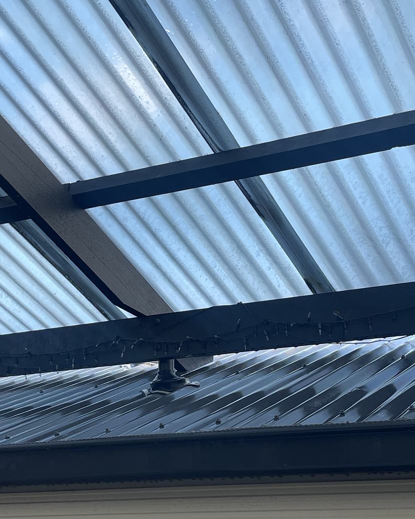 The same pergola clean, clear roofing letting the light through