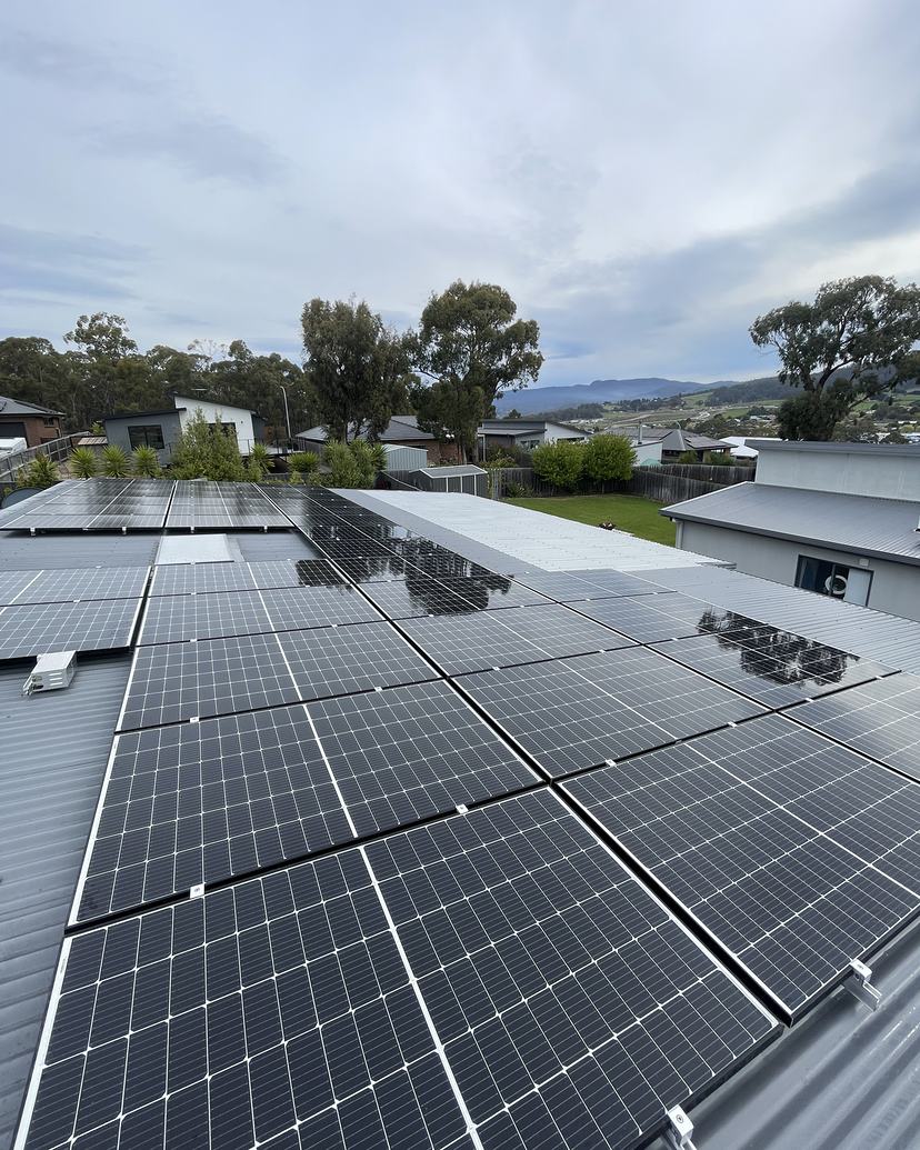 The same Kingston solar array clean after cleaning, valley view beyond