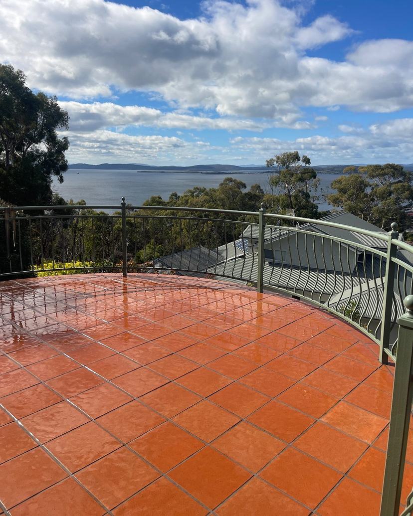 Clean terracotta tiled terrace in Kingston Beach with a view over the water