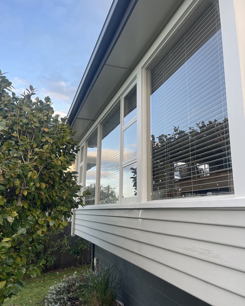Weatherboard home with clean, clear windows